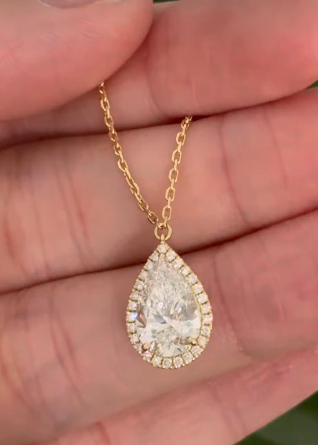 Yellow gold pear shaped lab diamond necklace. Center stone 2.07cts and measures 11x6.6mm. Chain is 16” with an adjustment of 4” to make as long as 20”.