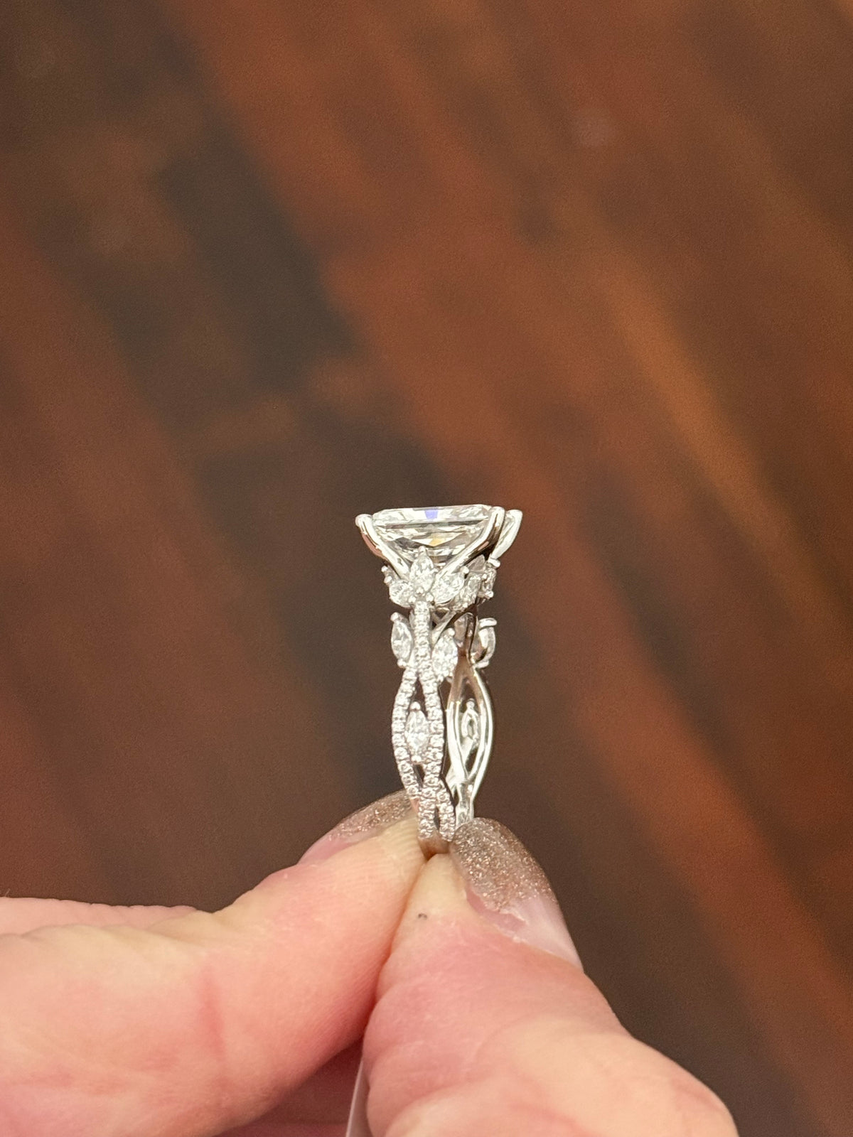 White gold radiant, marquise and round lab diamond ring. Center stone is 3.06cts E VS1 and measures 9.7x6.6mm