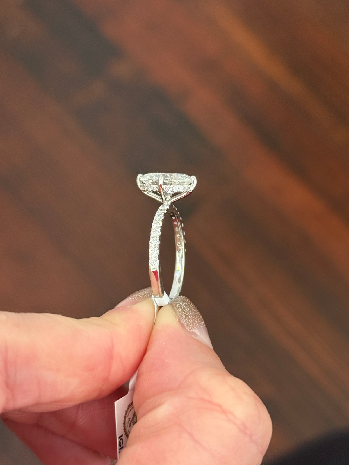 IGI certified white gold oval and round lab diamond ring