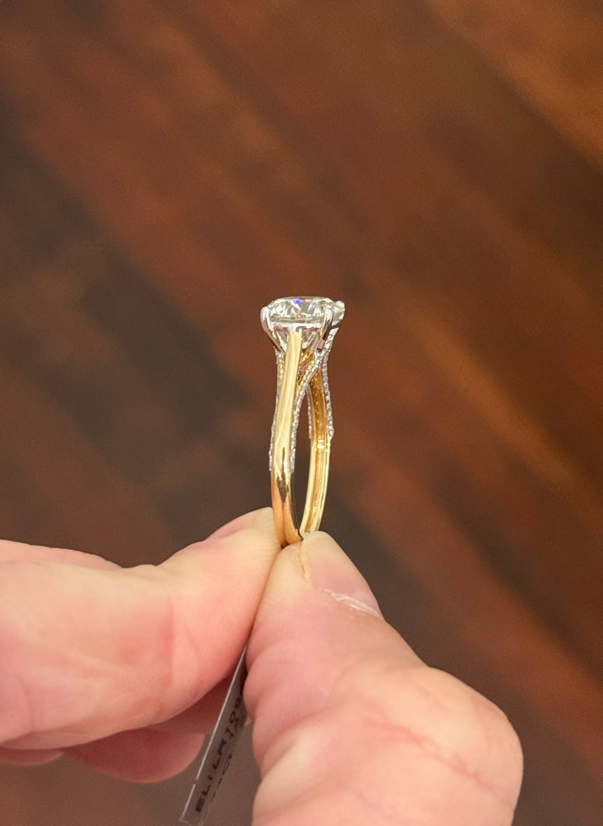 Yellow gold lab diamond ring. Lab diamonds are set in white gold.