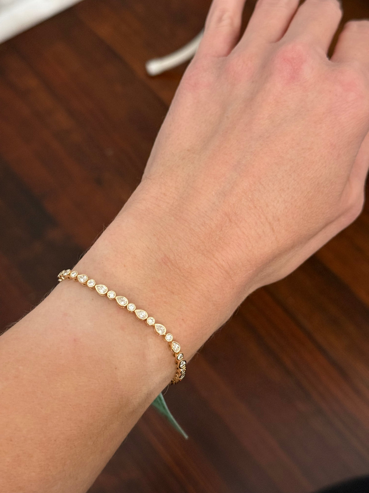 Yellow gold bezel set 3ct pear shape and round natural diamond bracelet