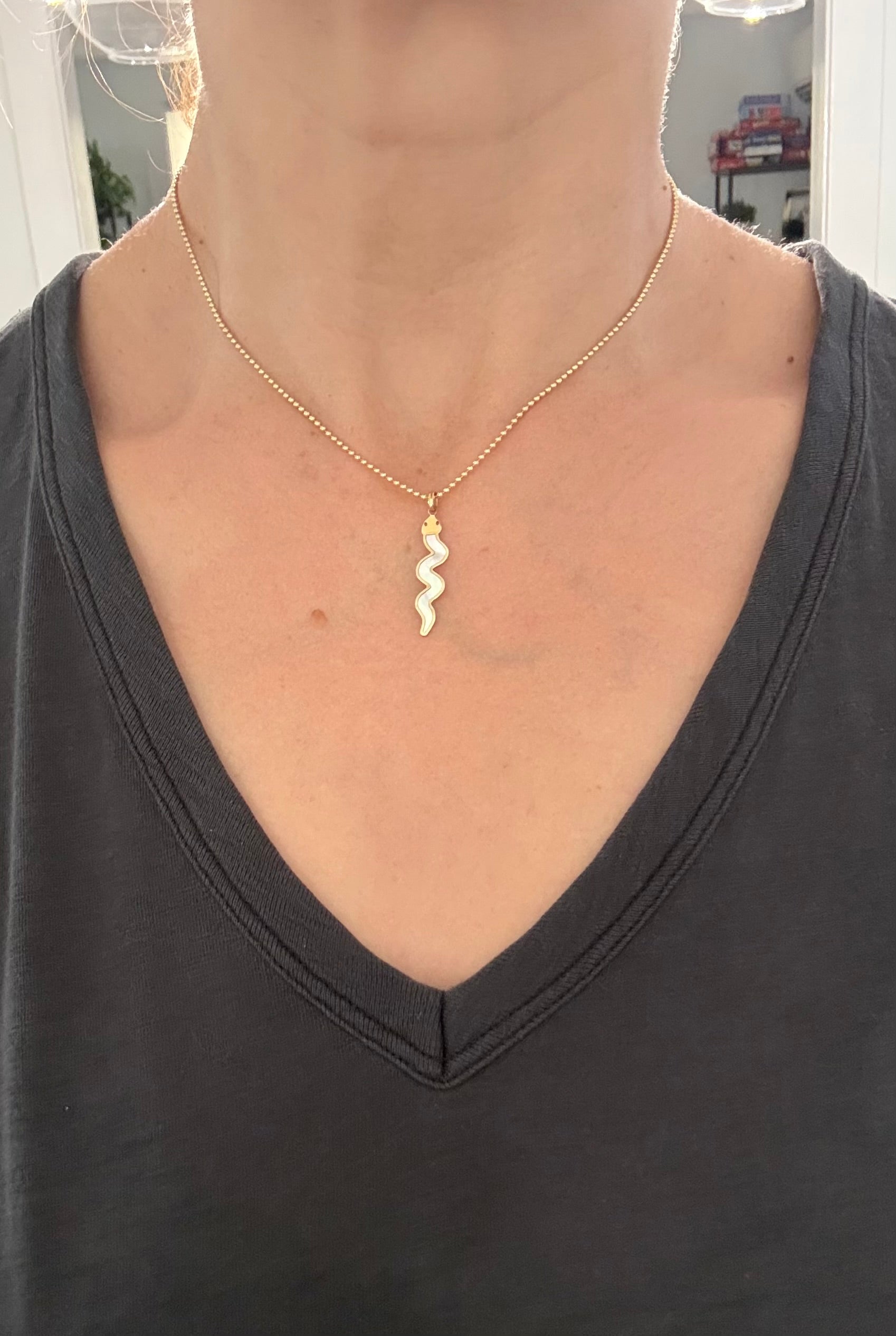 Yellow gold snake pendants