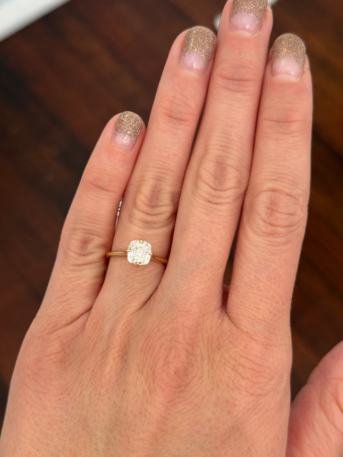 IGI certified yellow gold cushion and round lab diamond ring. Center stone is 1.57cts