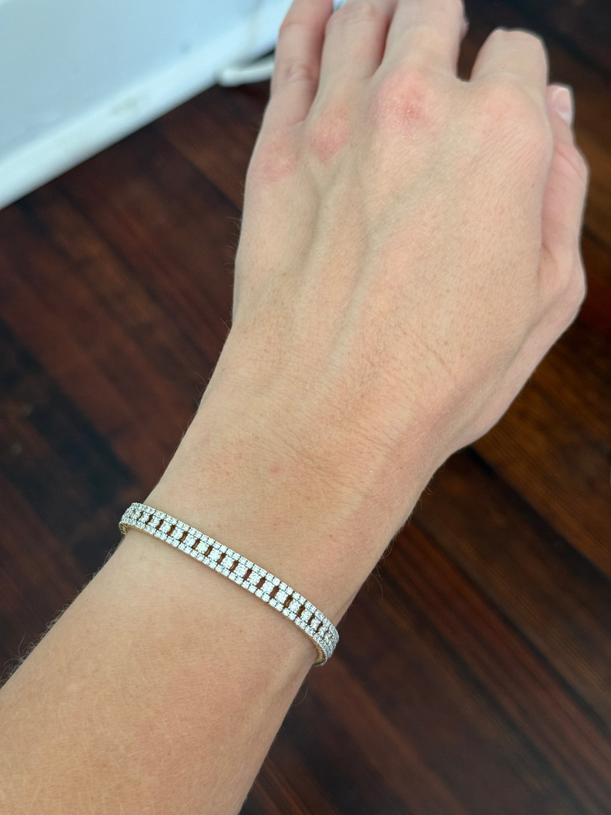 Yellow gold 5.56ct lab diamond bracelet. Prongs are white gold.