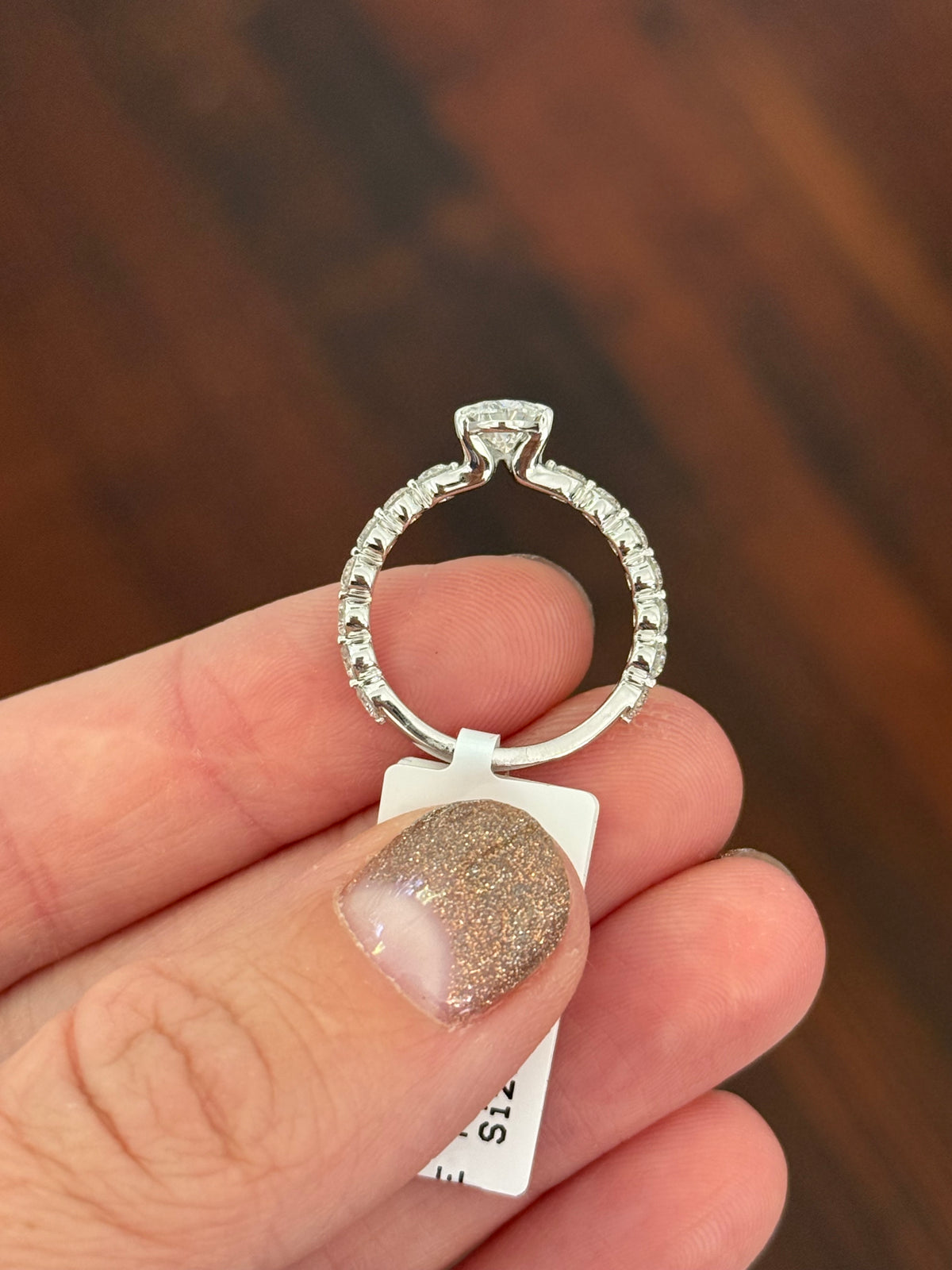 White gold pear shape and round lab diamond ring. Center stone is 1ct and approximately 9x5.3mm
