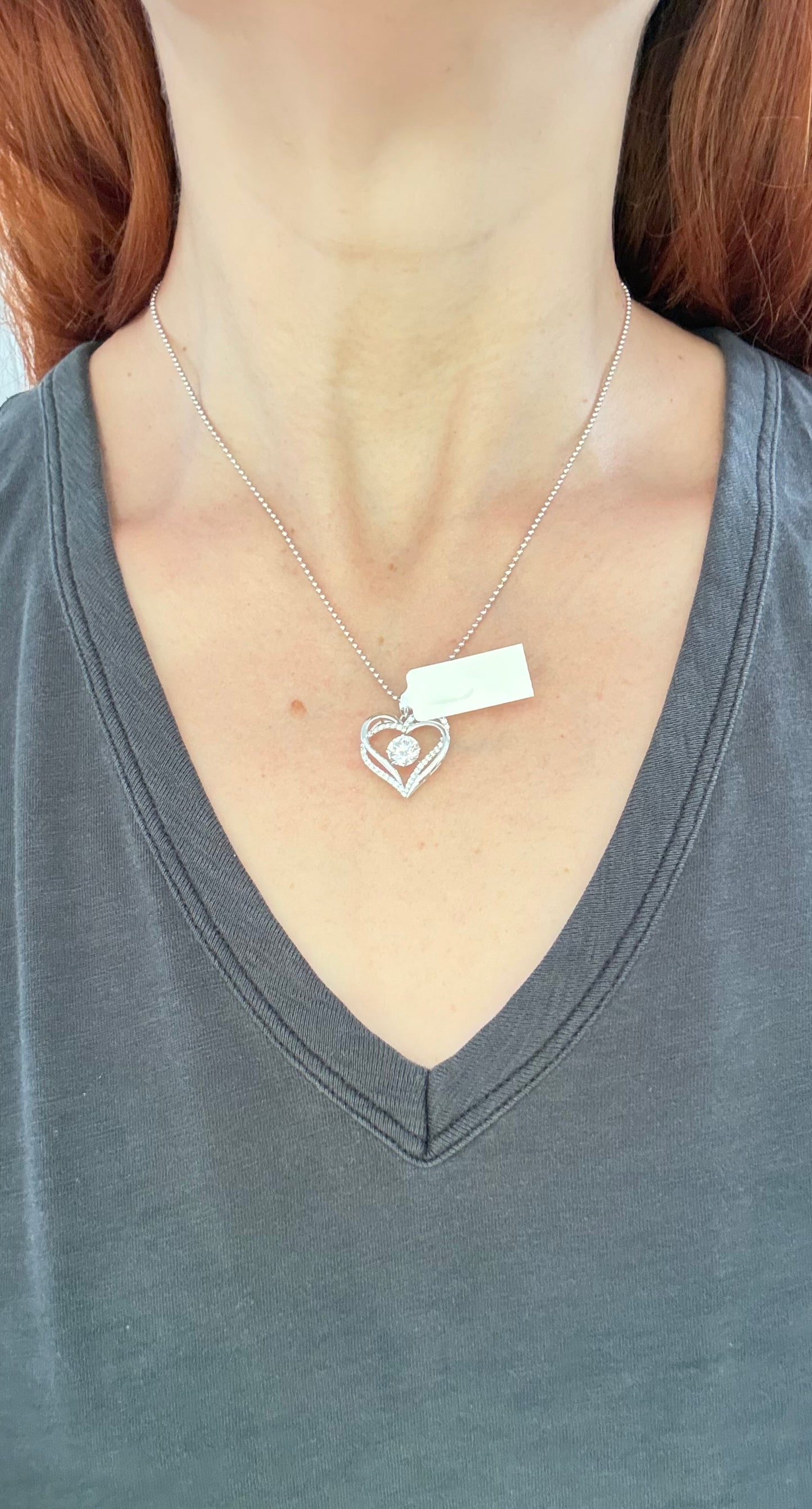 White gold heart pendant with round lab diamonds. Center stone is 7.0mm