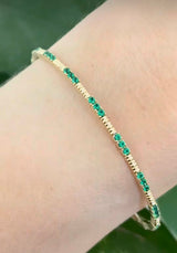 Yellow gold emerald flex bracelet
