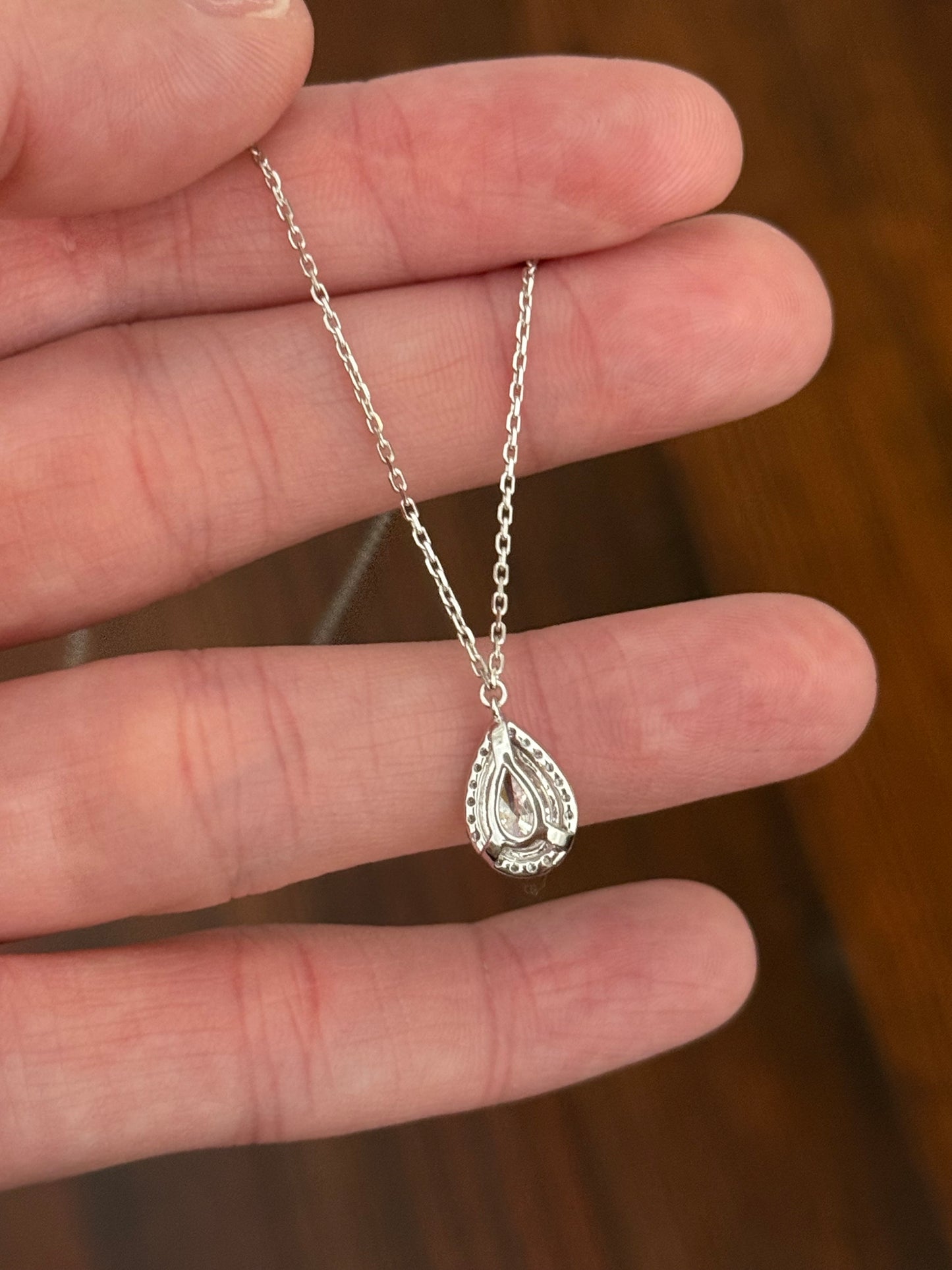 White gold pear shaped lab diamond necklace. Center stone is 1.07cts and measures 8.6x5.2mm.  Chain is 16” with an adjustment of 4” to make as long as 20”.