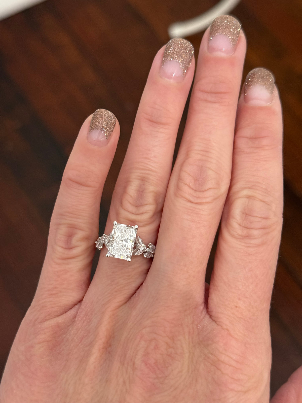 White gold radiant, marquise and round lab diamond ring. Center stone is 3.06cts E VS1 and measures 9.7x6.6mm