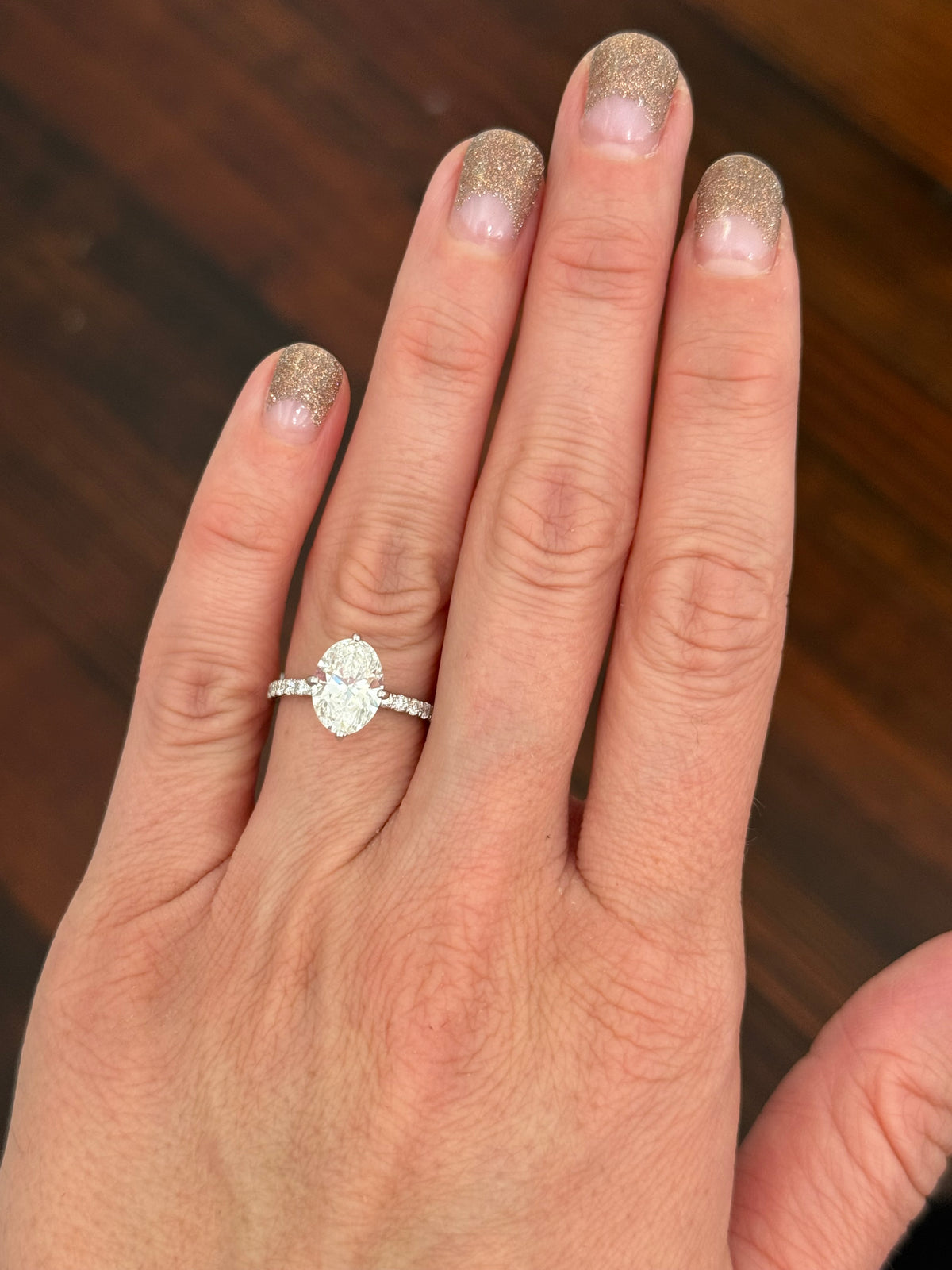 IGI certified white gold oval and round lab diamond ring