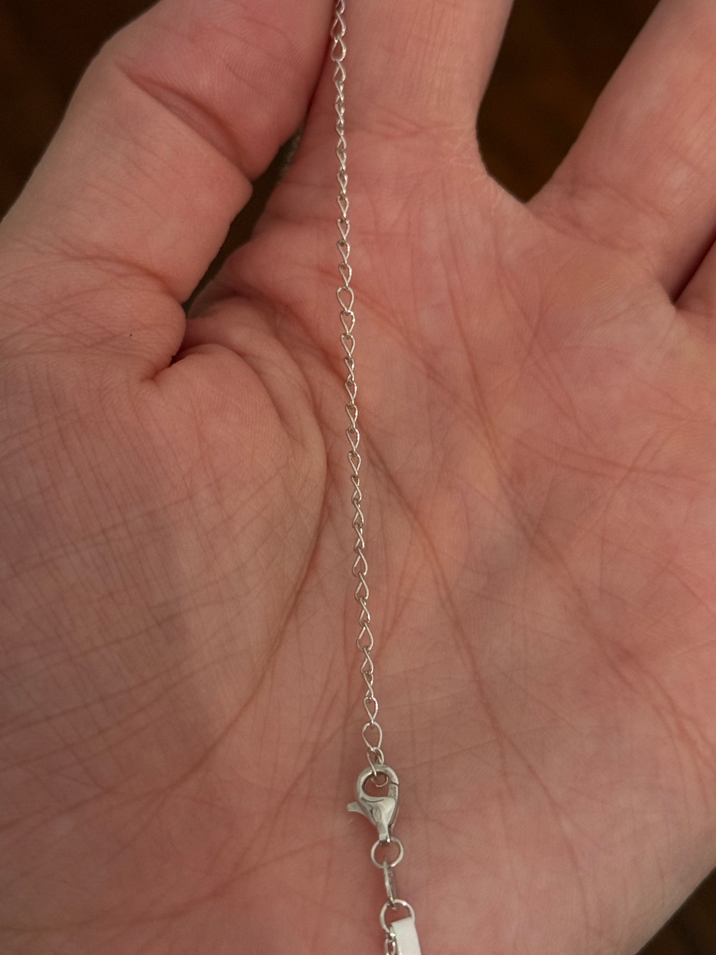 White gold emerald cut lab diamond necklace. Center stone is 0.50cts and measures 5.2x3.7mm. Chain is 16” with an adjustment of 4” to make as long as 20”.