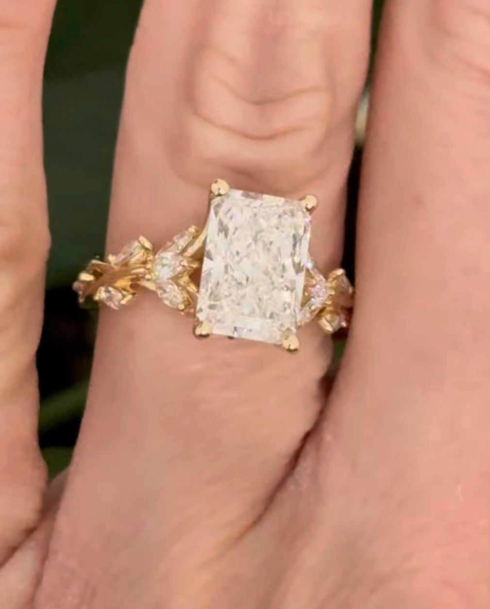 Yellow gold radiant and marquise lab diamond ring. Center stone is 3.07cts E VS1 and measures 9.8x6.7mm