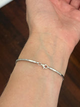 White gold flower bracelet with pear shaped yellow lab diamonds and round white lab diamonds