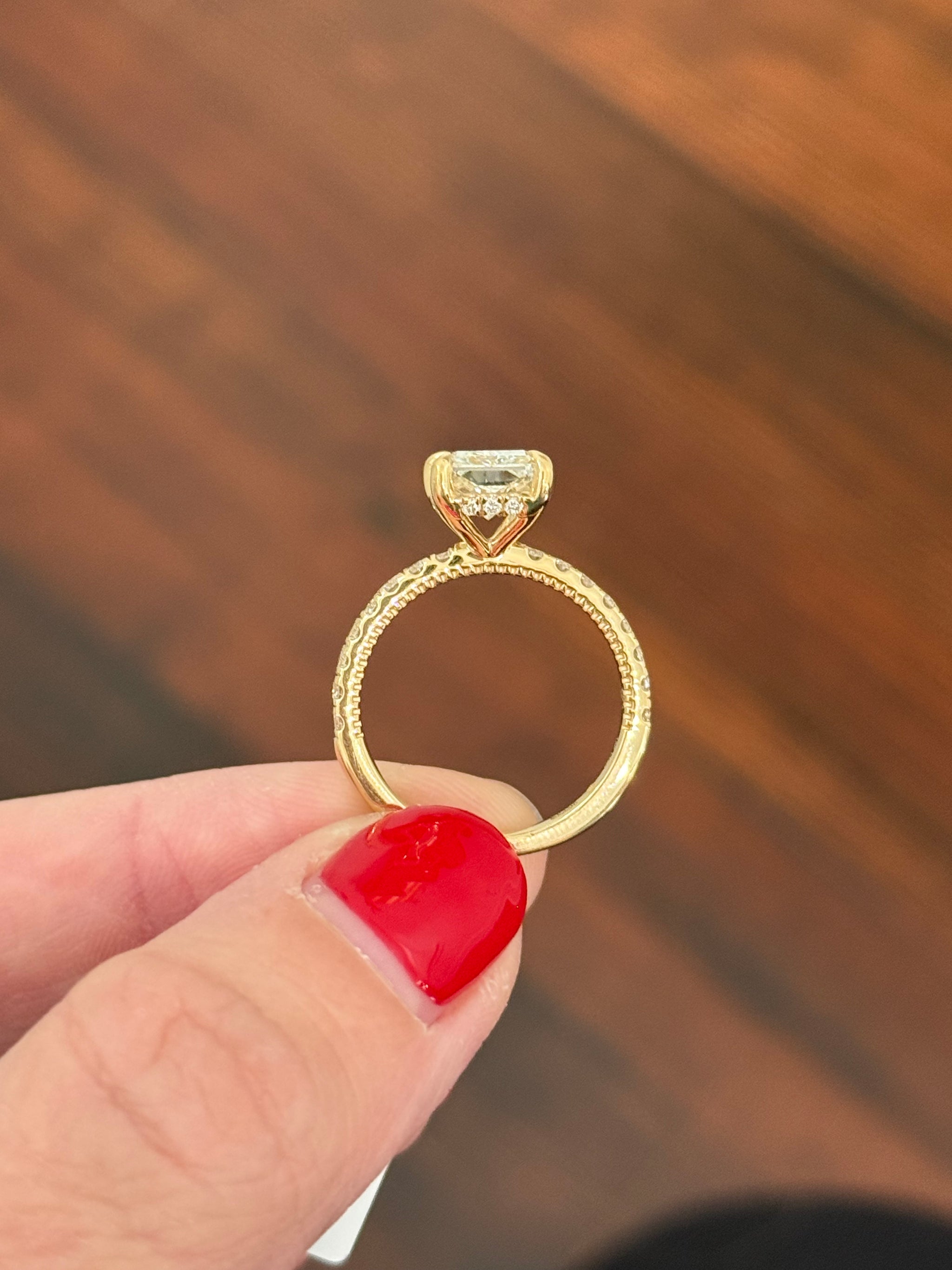 Yellow gold radiant lab diamond ring. Center stone is IGI certified and 3.0cts E VS1