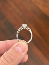 White gold IGI certified 2.02ct oval lab diamond and tapered baguette lab diamond ring. Oval measures 10.31x7.04x4.34mm