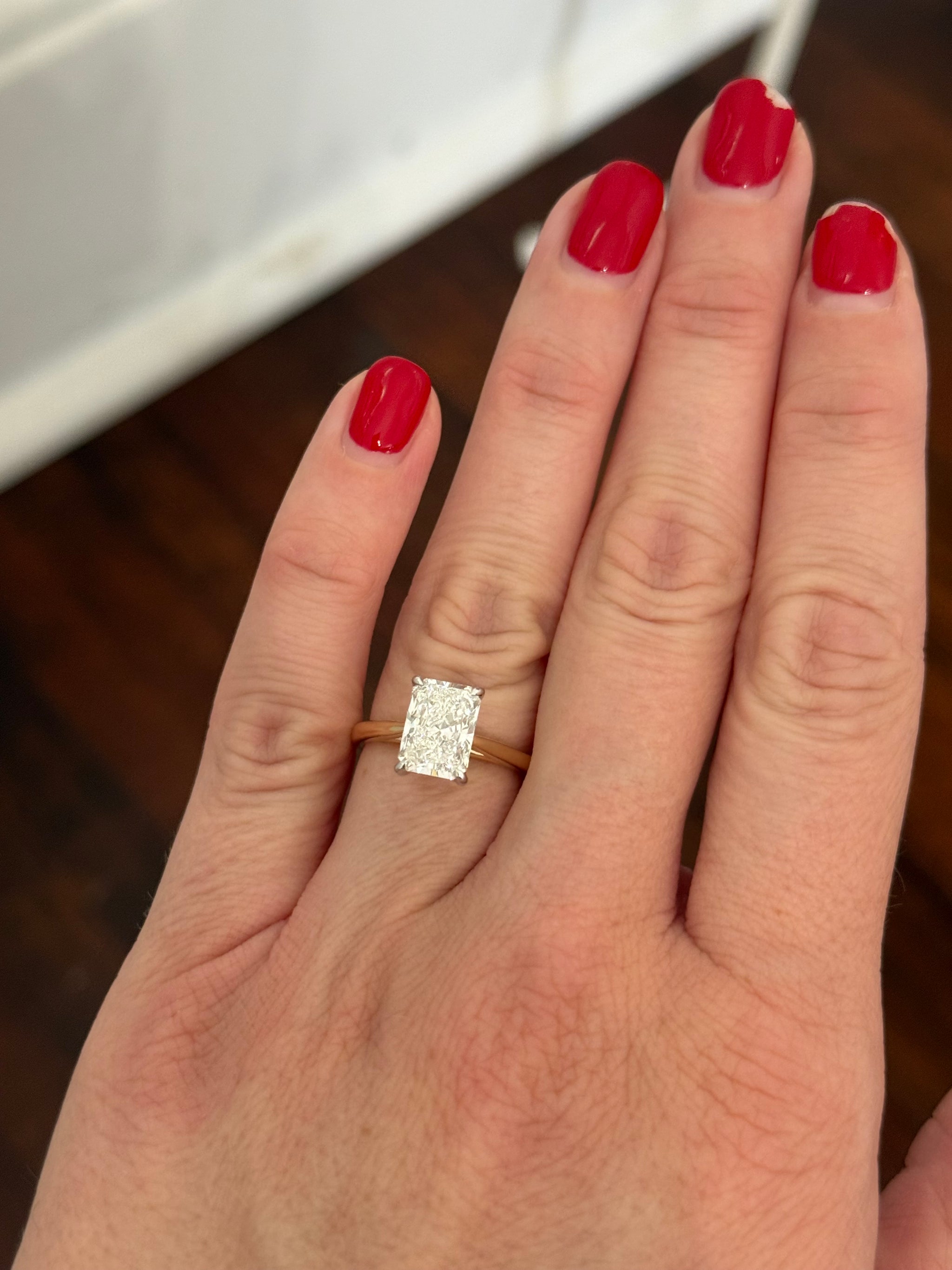 Yellow gold IGI certified radiant lab diamond ring. Lab diamond is set in white gold