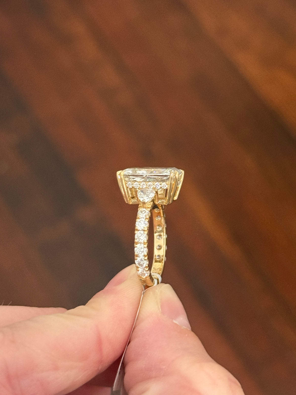 IGI certified radiant and trillion and round lab diamond ring. Center stone is 5.44cts