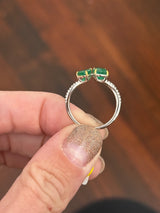 White gold natural emerald and diamond ring. Emeralds prongs are yellow gold.