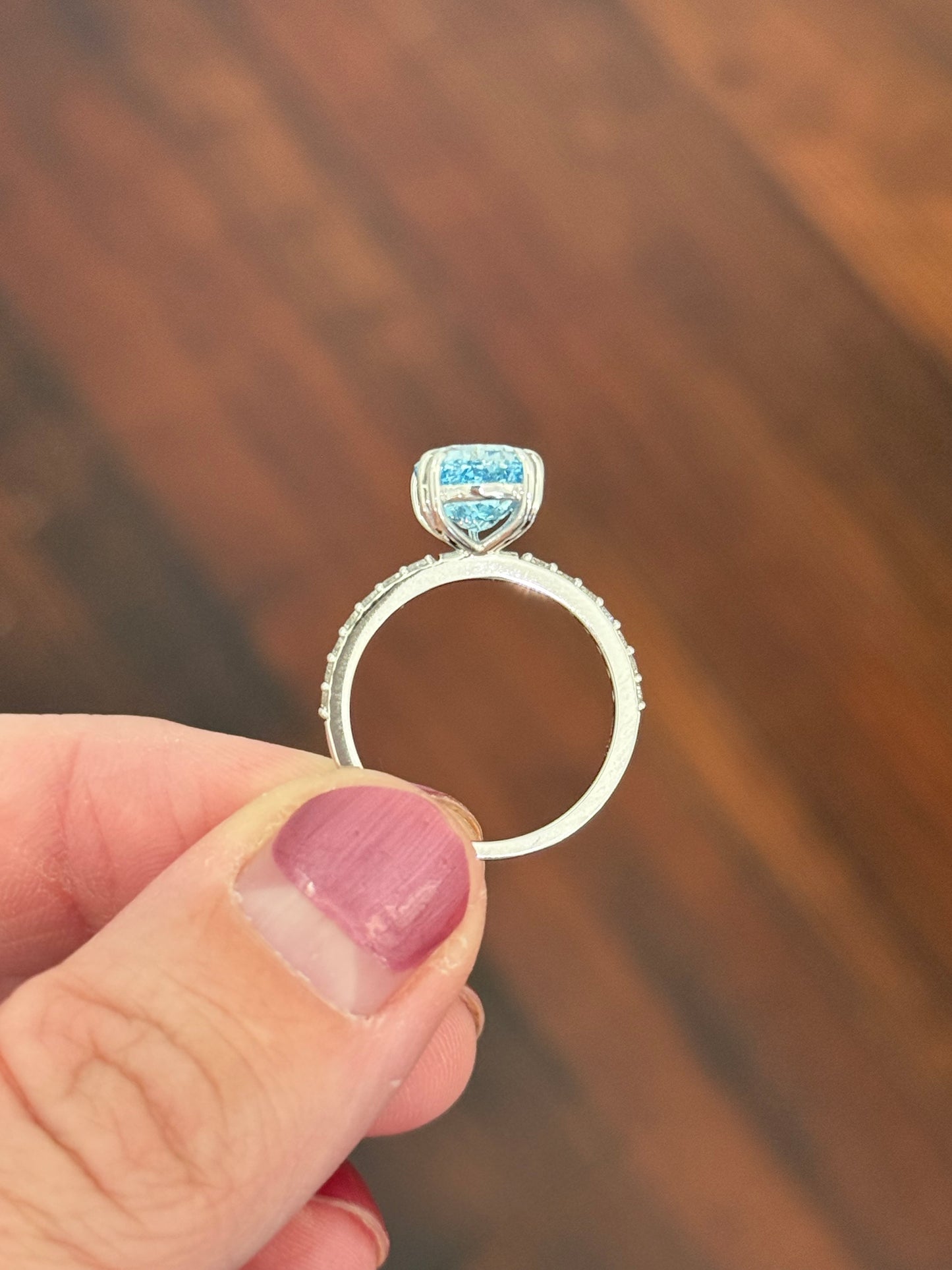 White gold pear shape blue lab diamond and white lab diamond ring