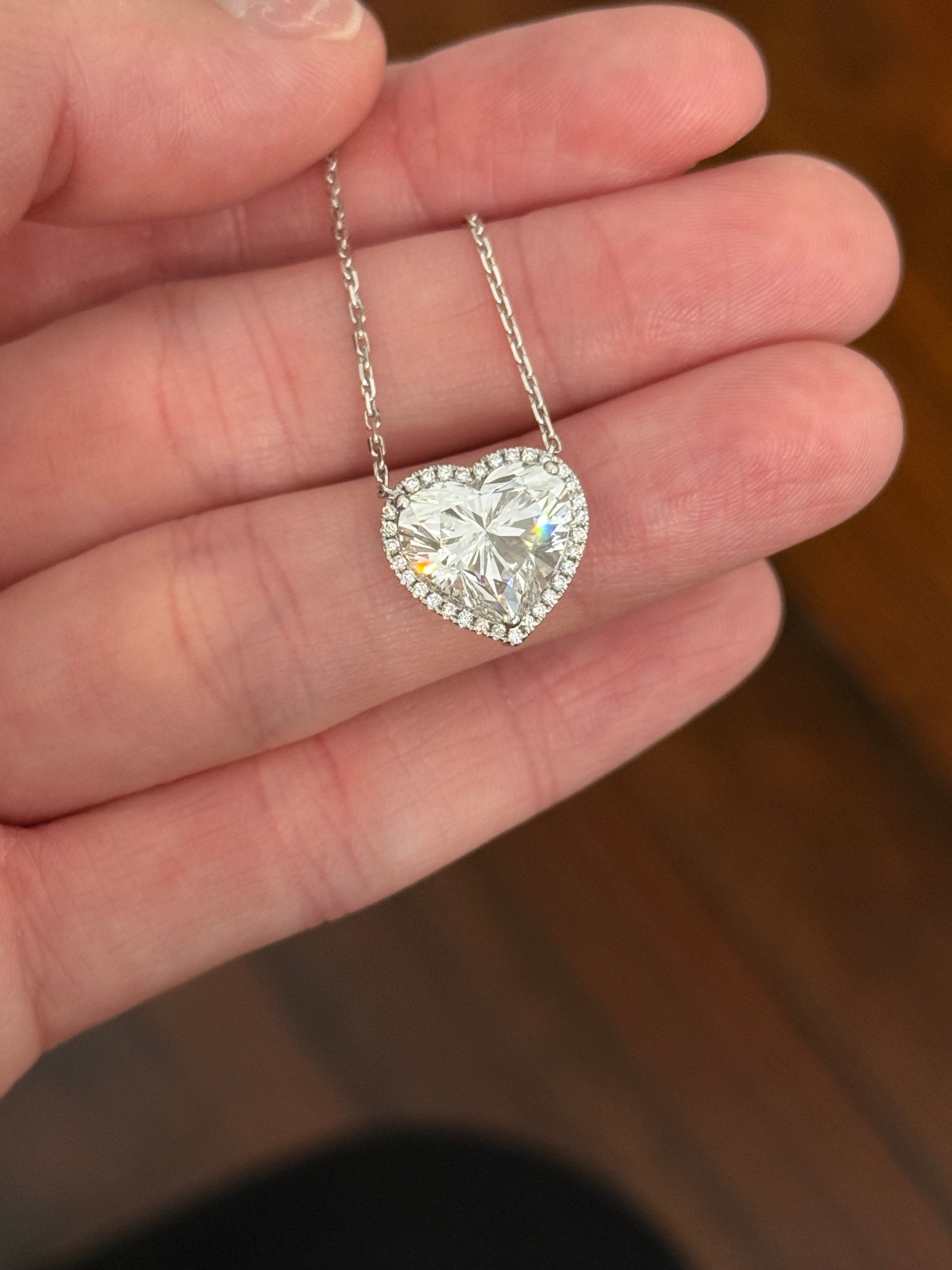 White gold heart shape lab diamond necklace. Center stone is 5.08cts and measures 10.x11.3mm. Chain is 16” with 4” of adjustment to make as long as 20”.