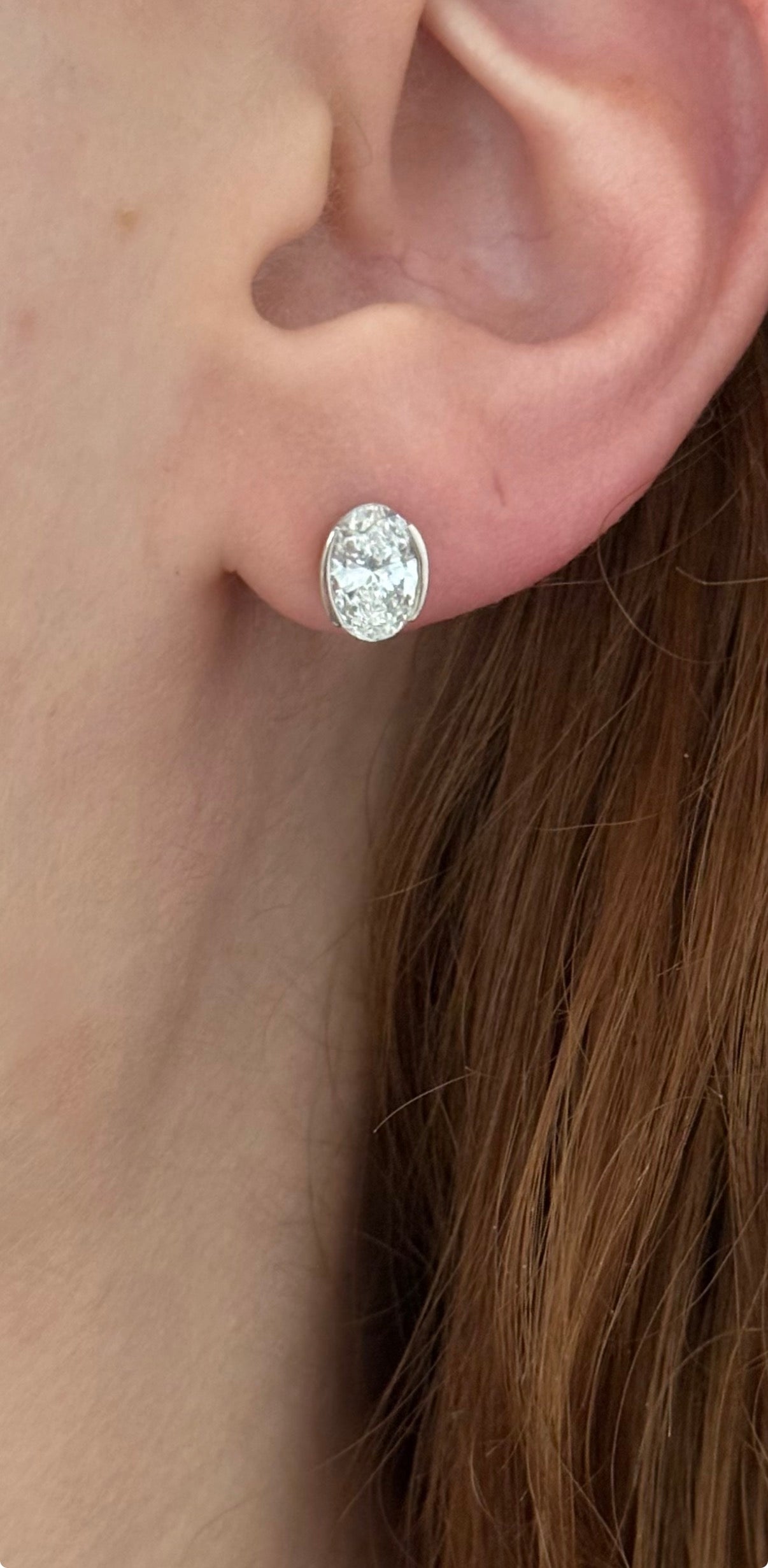 White gold bezel set oval lab diamond stud earrings