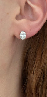 White gold bezel set oval lab diamond stud earrings