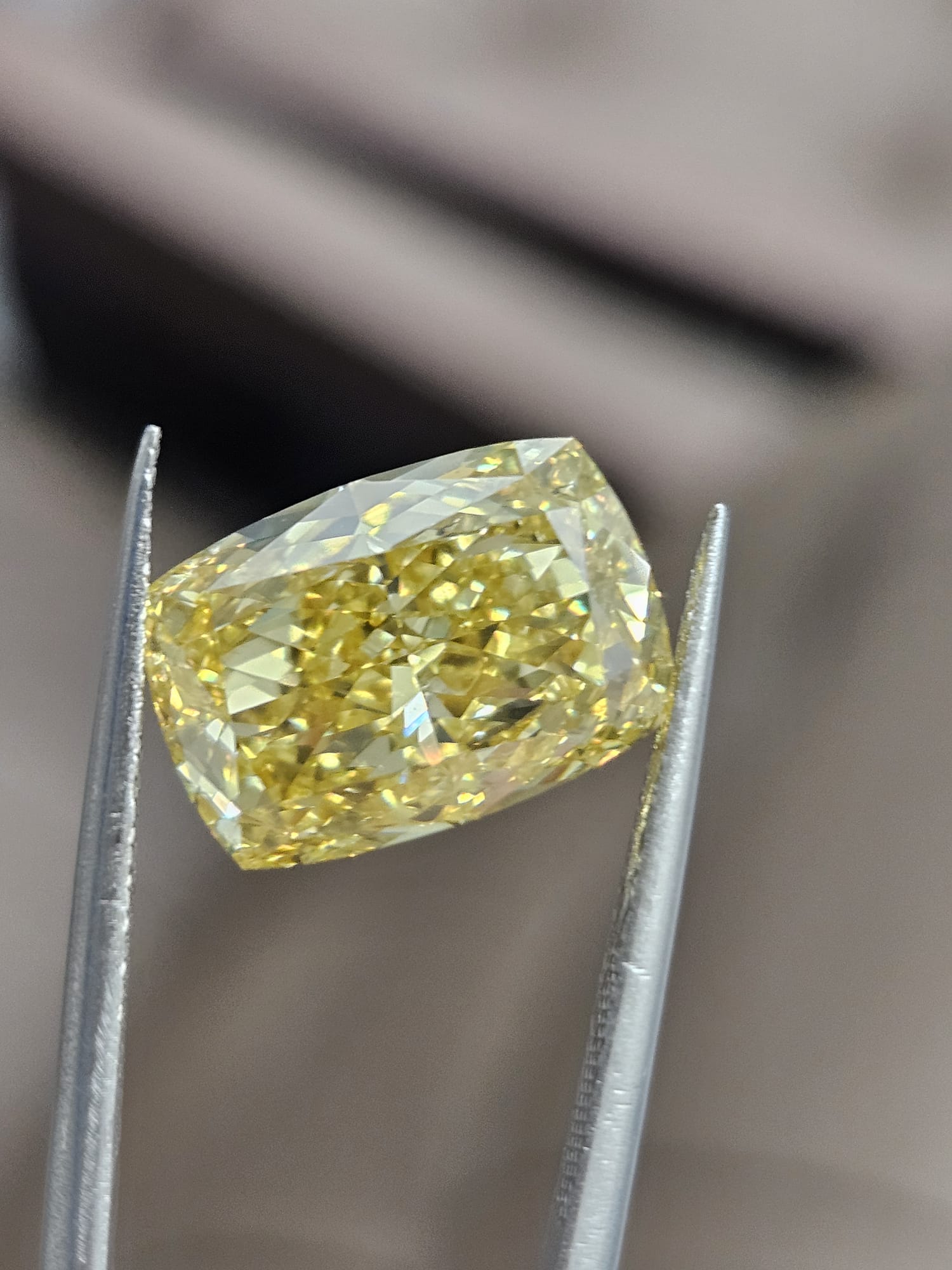 IGI 7.25CT CUSHION FANCY VIVID YELLOW VS1