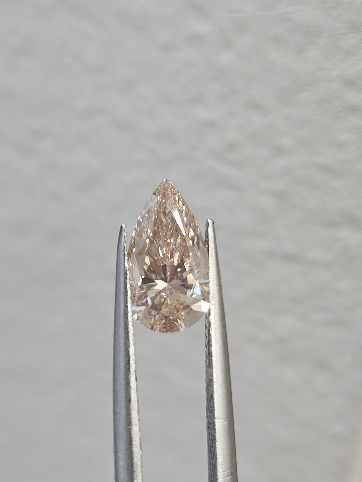 IGI 1.01CT PEAR FANCY LIGHT PINKISH BROWN VS1