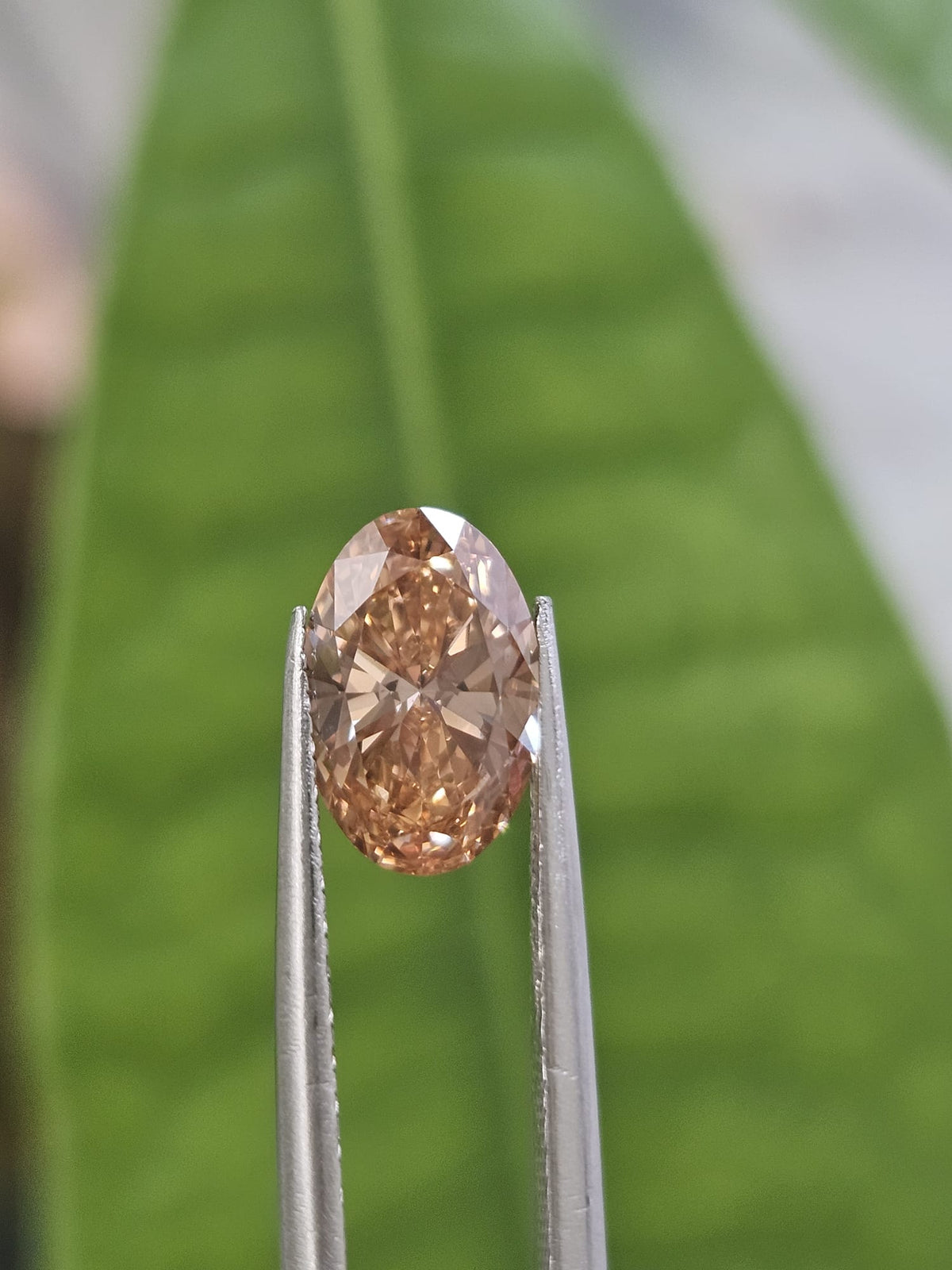 IGI 1.51CT OVAL FANCY PINKISH BROWN VS2