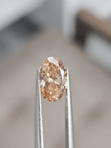 IGI 1.51CT OVAL FANCY PINKISH BROWN VS2