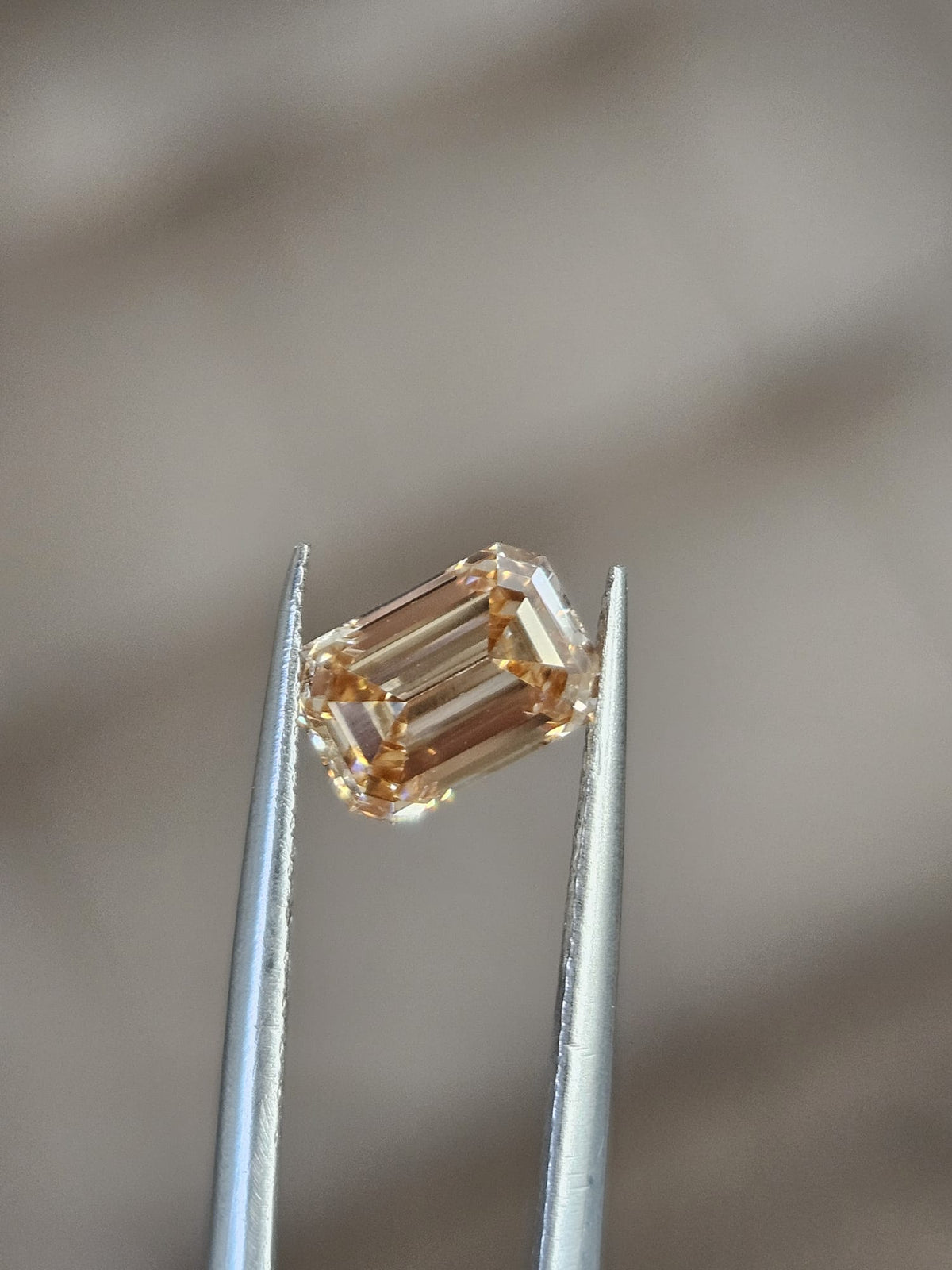 IGI 1.25CT EMERALD FANCY LIGHT PINKISH BROWN VS1