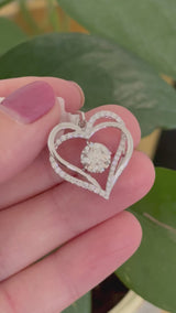 White gold heart pendant with round lab diamonds. Center stone is 7.0mm