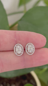 White gold oval cluster studs with round diamonds