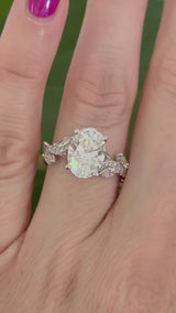 White gold oval, marquise and round lab diamond ring. Center stone is 3.07cts