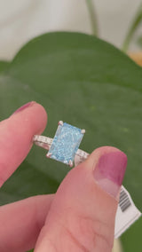 White gold radiant blue lab diamond and white lab diamond ring