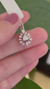White gold trillion, pear shape and marquise lab diamond pendant. Center stone measures 5.1x5.5mm