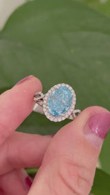 White gold oval blue lab diamond and white lab diamond ring