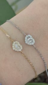 Heart chain bracelets with baguette and round diamonds available in yellow and white gold