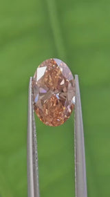 IGI 1.51CT OVAL FANCY PINKISH BROWN VS2