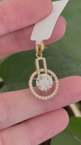 Yellow gold lab diamond pendant. Center stone is 8.0mm and set in white gold
