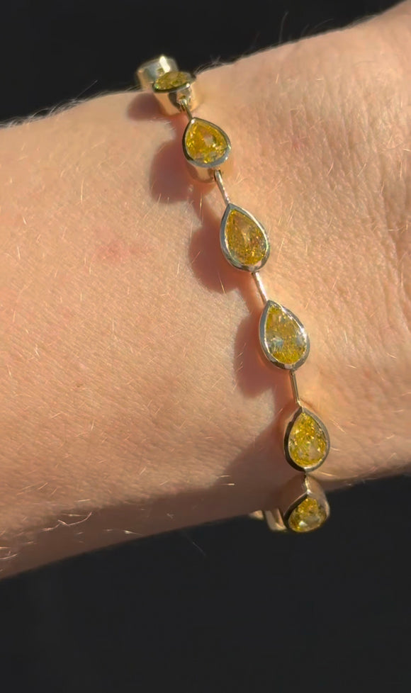 Yellow gold bezel set 10.93ct yellow pear shape lab diamond bracelet